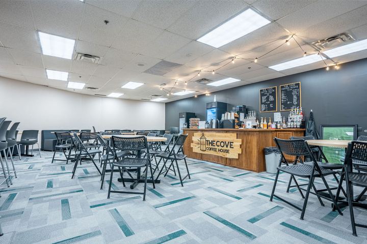 Commercial carpet tile in gray and teal geometric planks in a school coffee house seating area in Indianapolis, IN