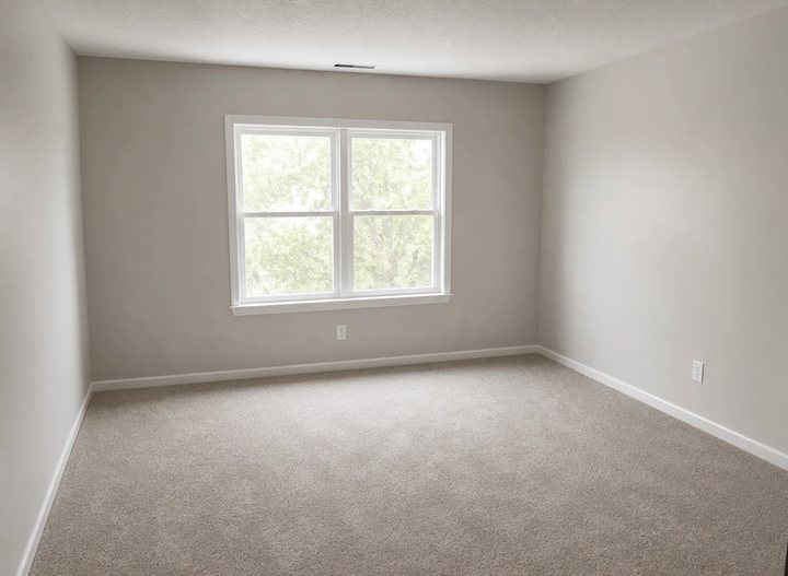 Fresh neutral carpet in a bedroom with a bright double window in Indianapolis, IN