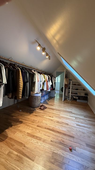 Refinished red oak hardwood in an attic walk-in closet with sloped ceiling in Brownsburg, IN