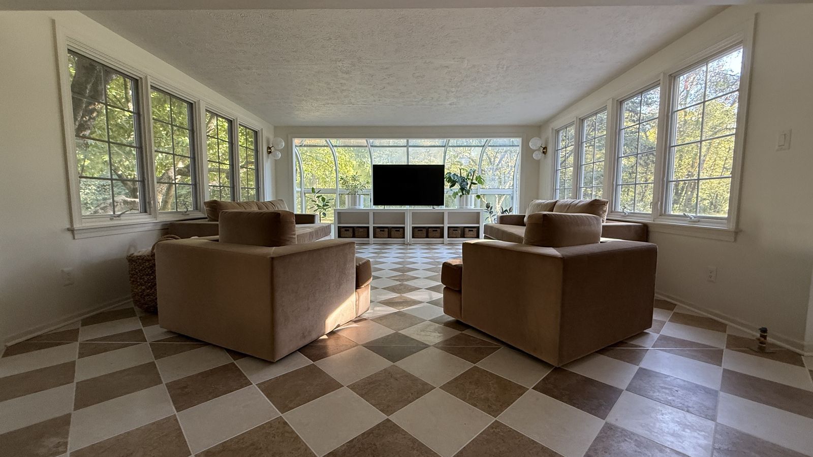 Tan and cream checkerboard tile floor in a Brownsburg sunroom